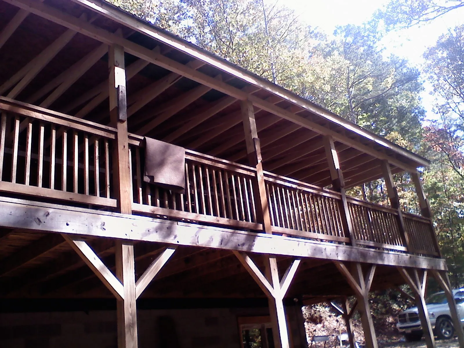 Timber framing under a new elevated porch and deck — Roof Leak Repair in Munnsville by Roofing Brothers